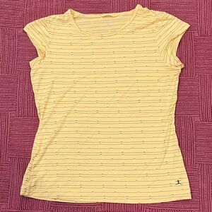 Danskin Women’s size medium exercise top or under layer in lovely yellow hue.